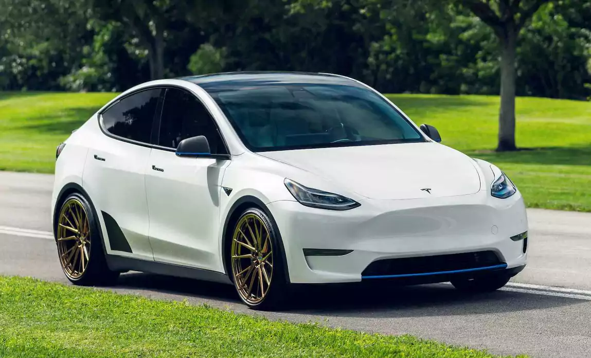 Tesla model Y driving down the road-1